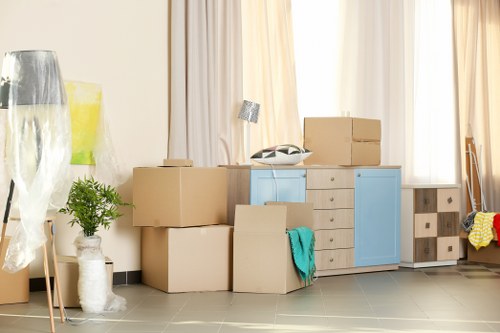 Student removals team helping with boxes in a Haringey flat move