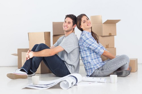 Packed boxes and furniture ready for loading into a removal van